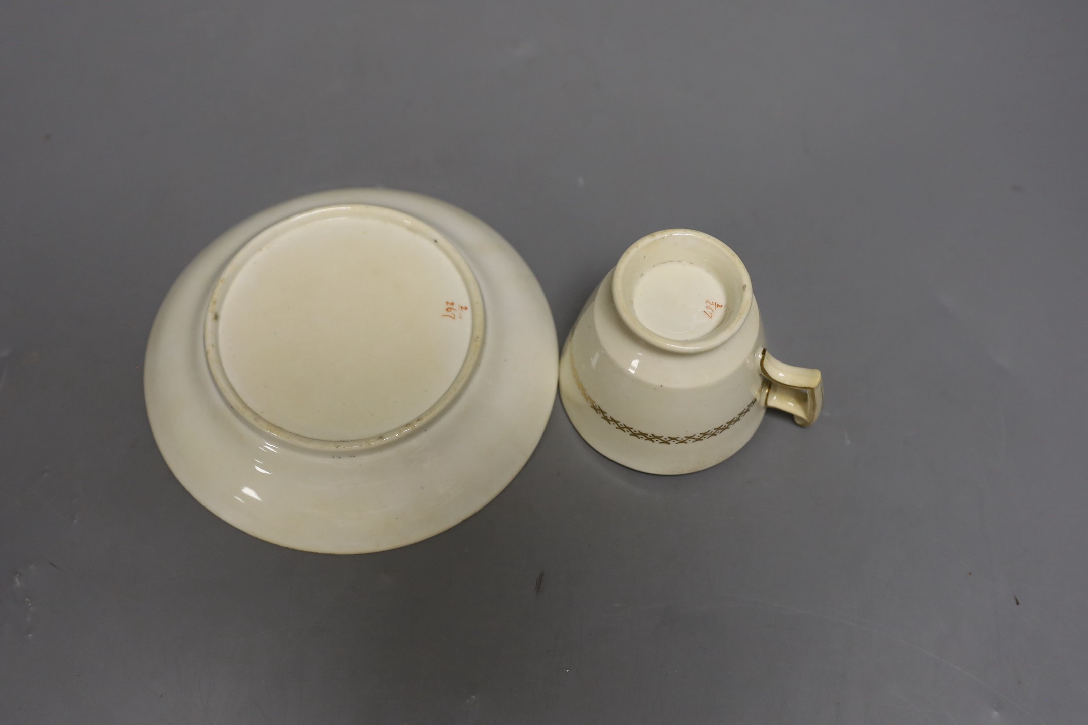 A Chinese famille rose tea bowl, similar small vase and a London shape coffee cup and saucer